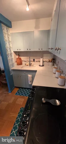 a view of a dining room with furniture and a window