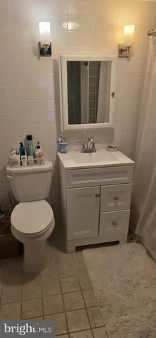 a view of a living room and bedroom