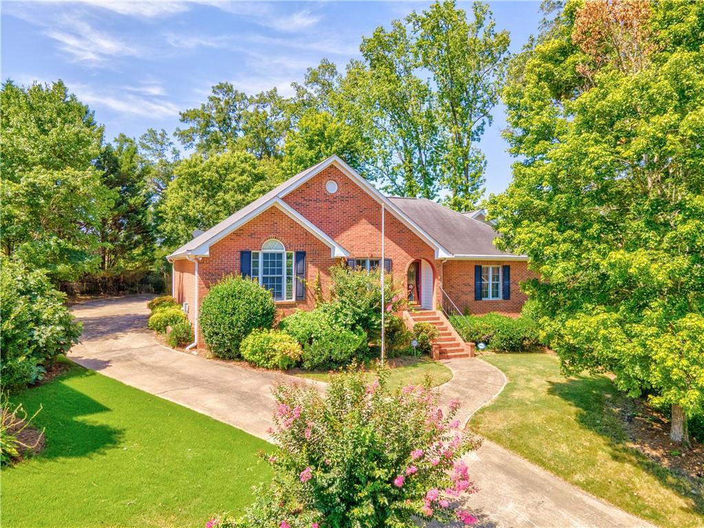 9 Stonegable Drive Northwest Rome, GA 30165 - Photo 1 of 1 a house view with a garden space