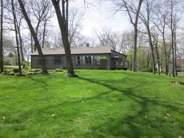 2037 Hillsdown Road Lake Summerset, IL 61019 - Photo 20 of 24 a view of a yard with plants and trees