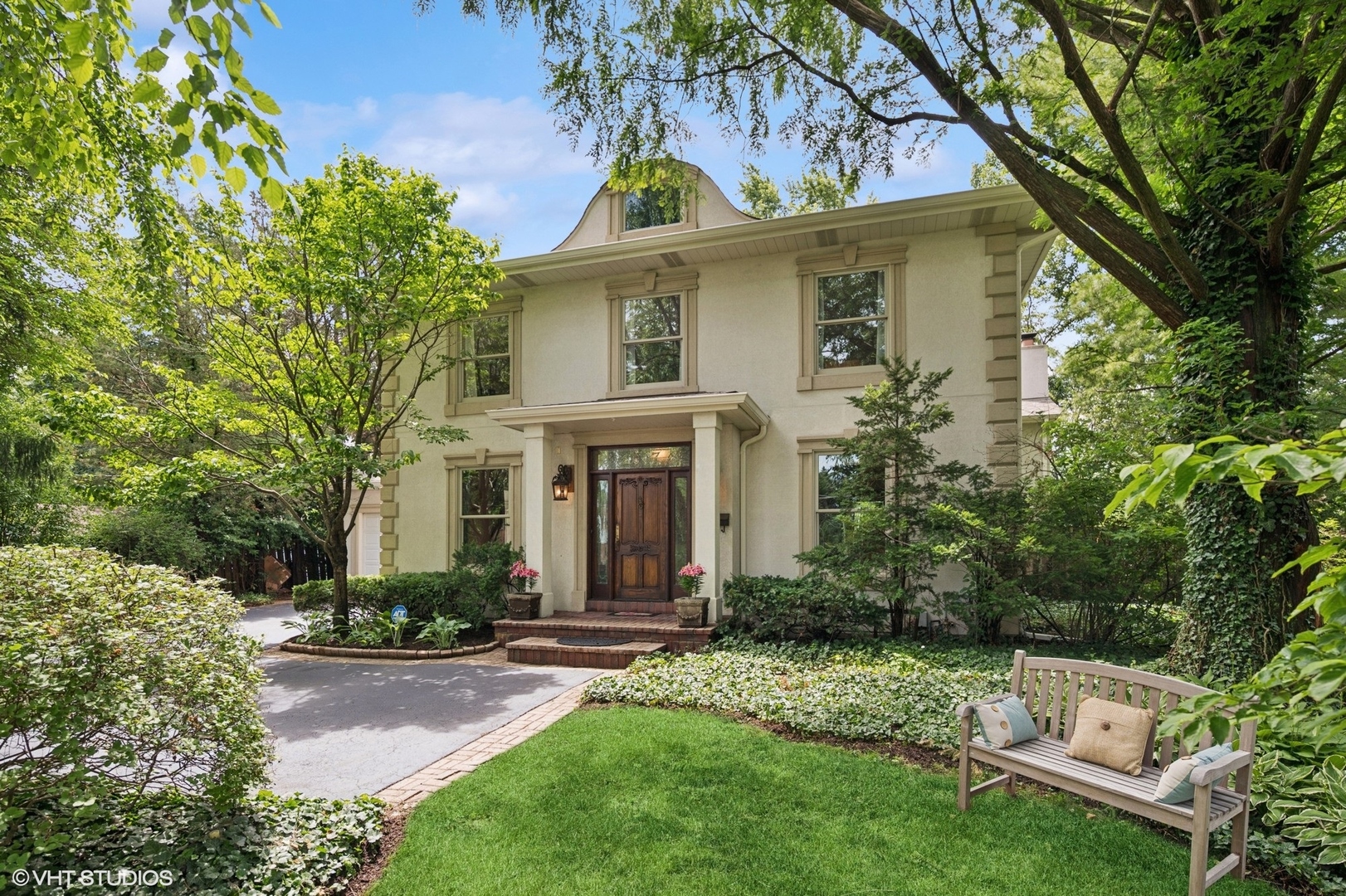 2007 Wilmette Avenue Wilmette, IL 60091 - Photo 1 of 35 a front view of a house with a yard and trees
