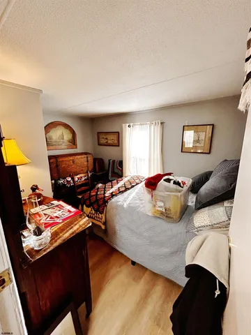 a bedroom with a bed and dresser