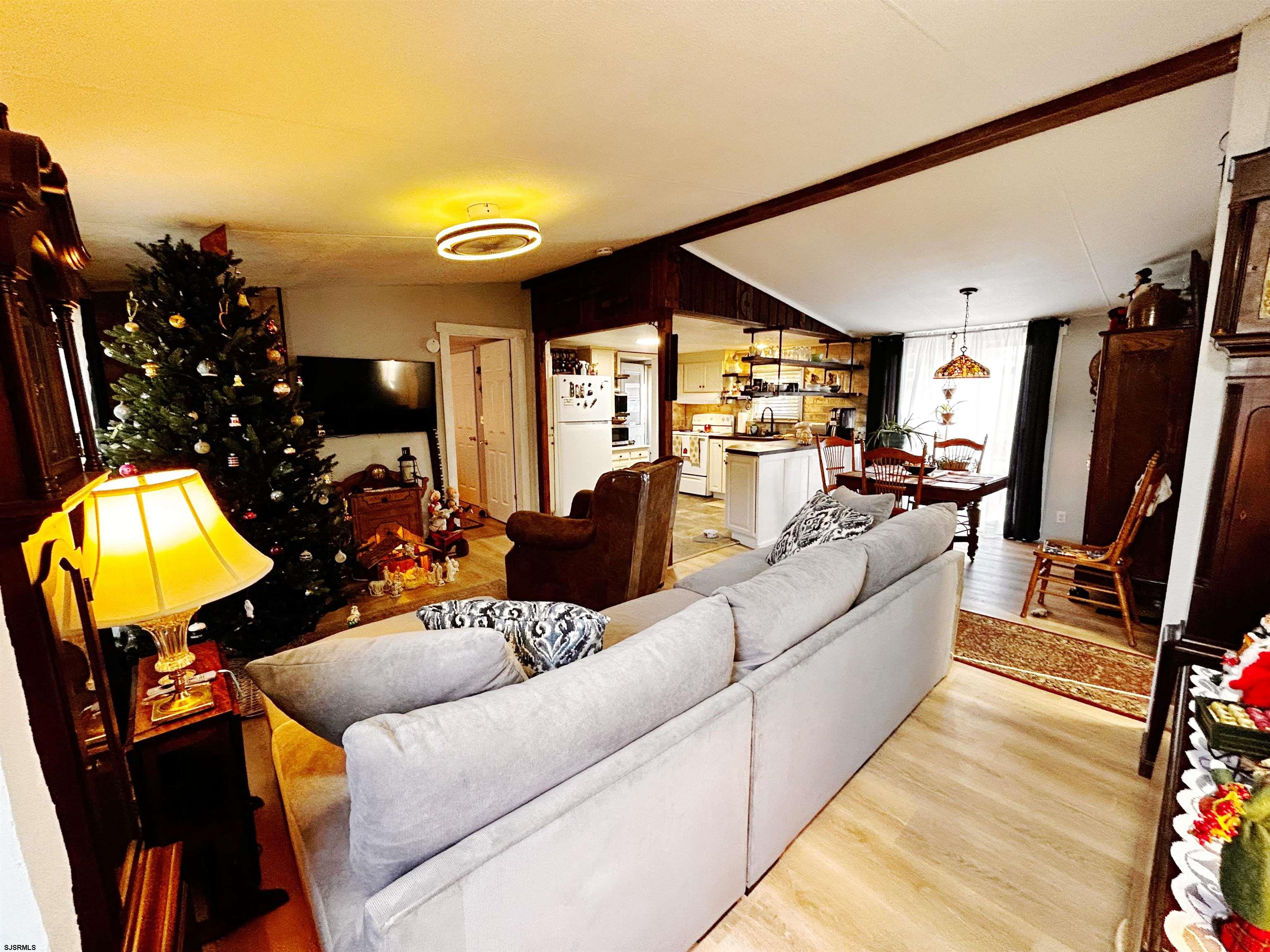 260 Marshall Mill Road Malaga, NJ 08328 - Photo 4 of 19 a living room with furniture and a flat screen tv