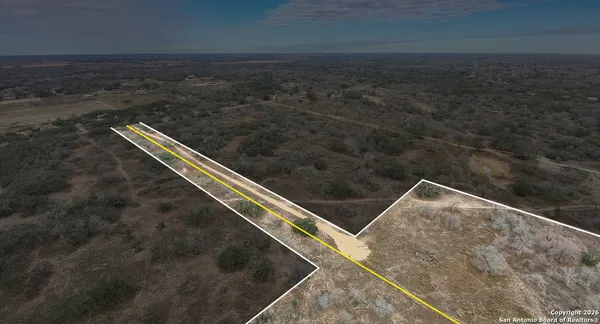 a backyard of a house with large trees