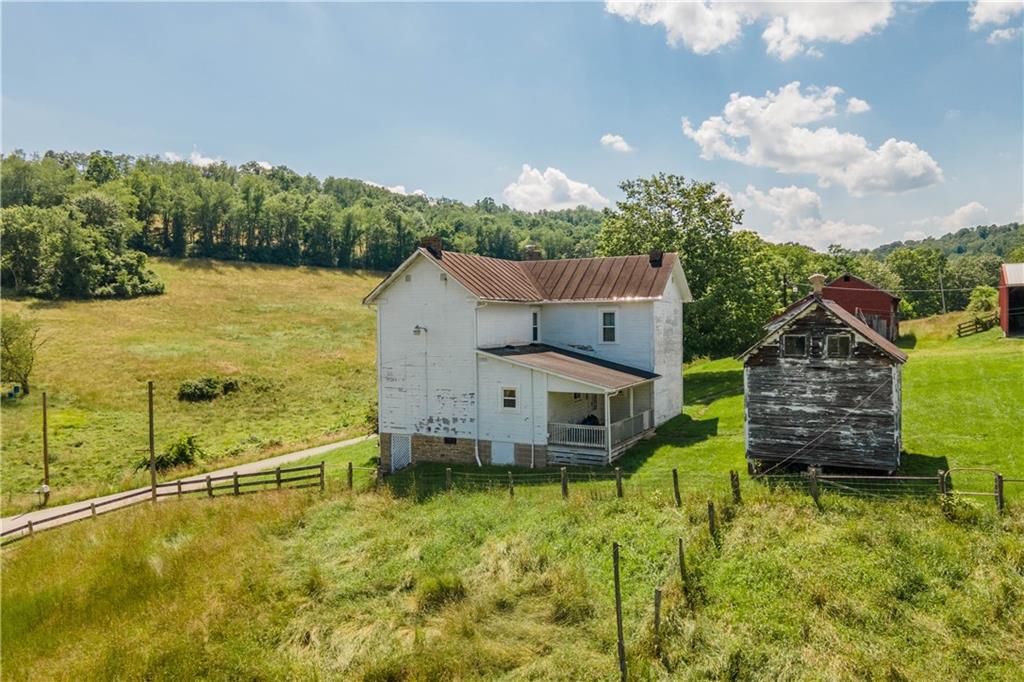 481 Dille Run Road Prosperity, PA 15329 - Photo 21 of 38 an aerial view of a house with a garden and lake view