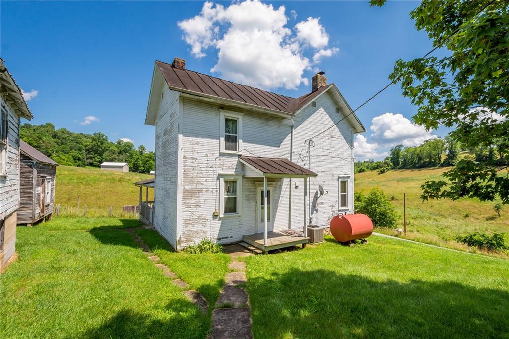 481 Dille Run Road Prosperity, PA 15329 - Photo 22 of 38 a front view of a house with garden