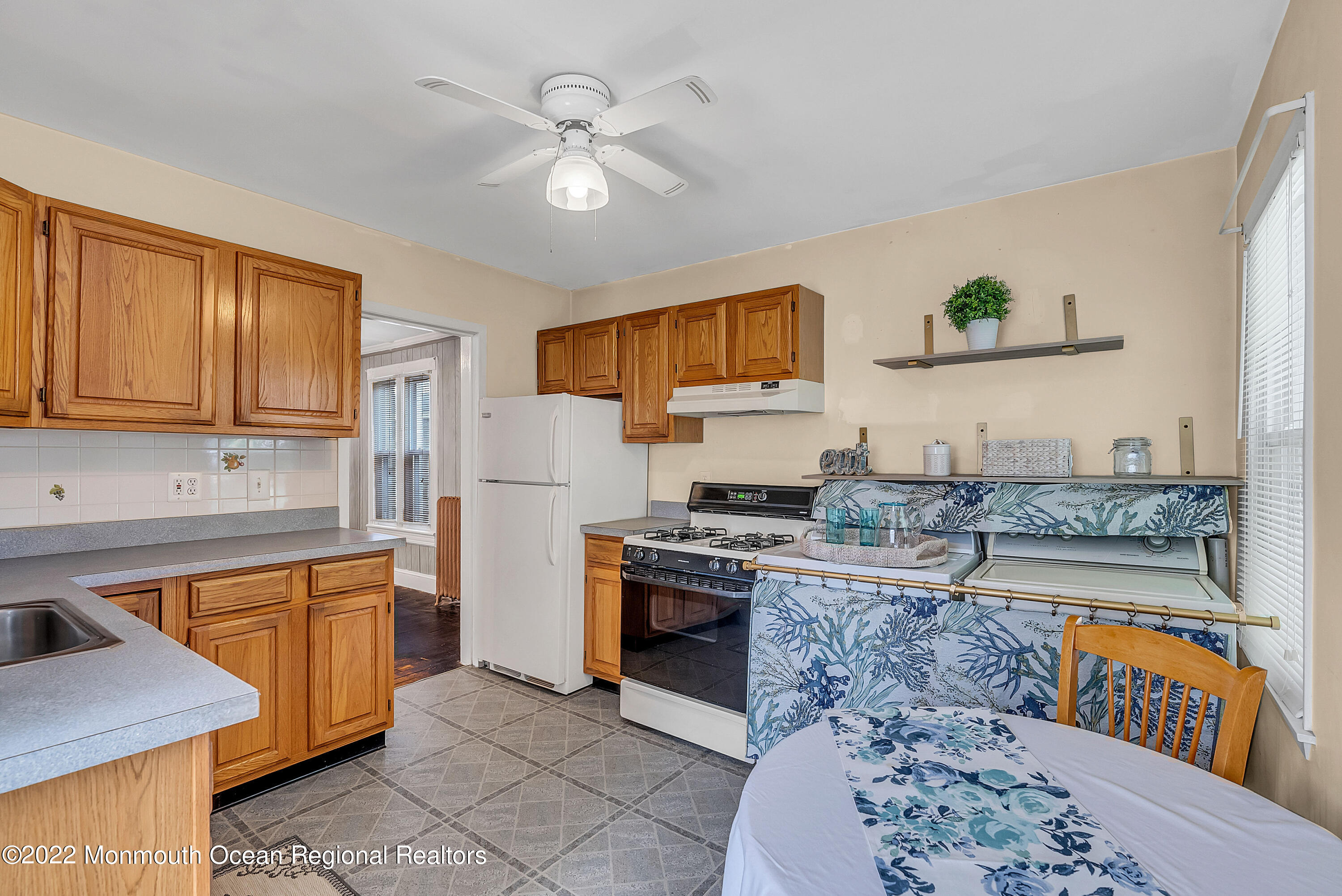 97 Mechanic Street Red Bank, NJ 07701 - Photo 14 of 28 a kitchen with stainless steel appliances granite countertop a stove top oven a sink a counter space and cabinets