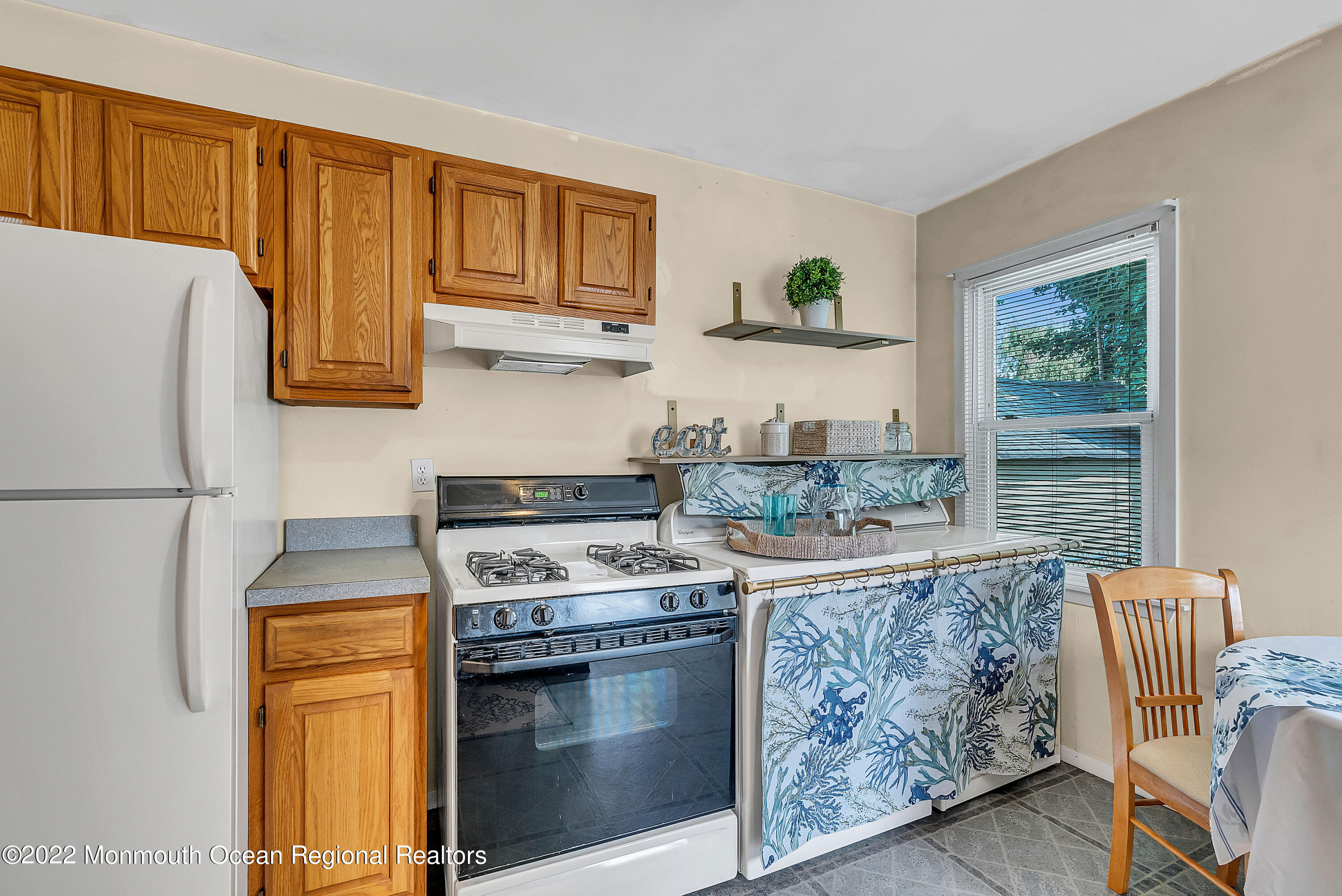 97 Mechanic Street Red Bank, NJ 07701 - Photo 16 of 28 a kitchen with stainless steel appliances granite countertop a stove a refrigerator and a microwave