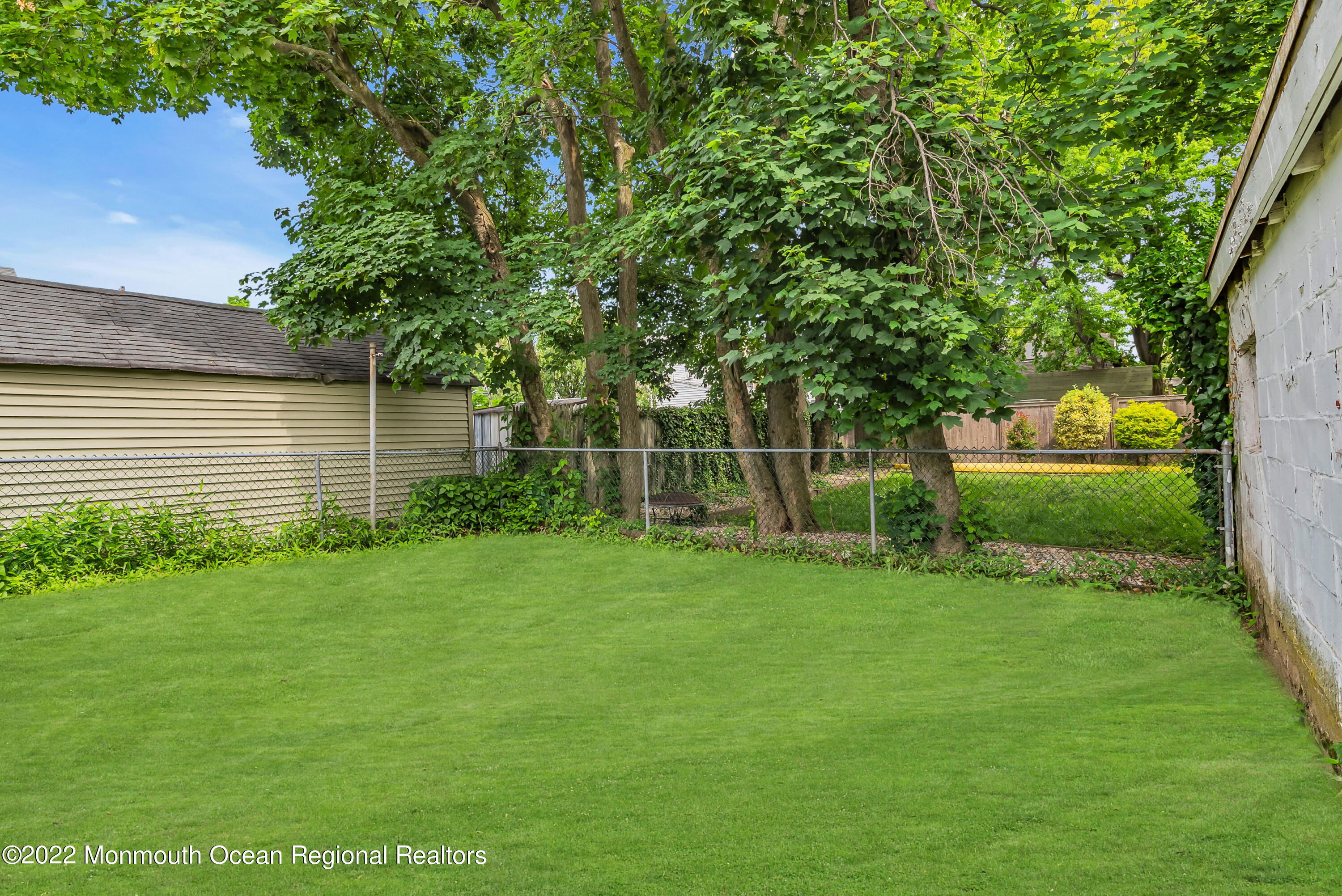 97 Mechanic Street Red Bank, NJ 07701 - Photo 25 of 28 a view of a backyard with a garden