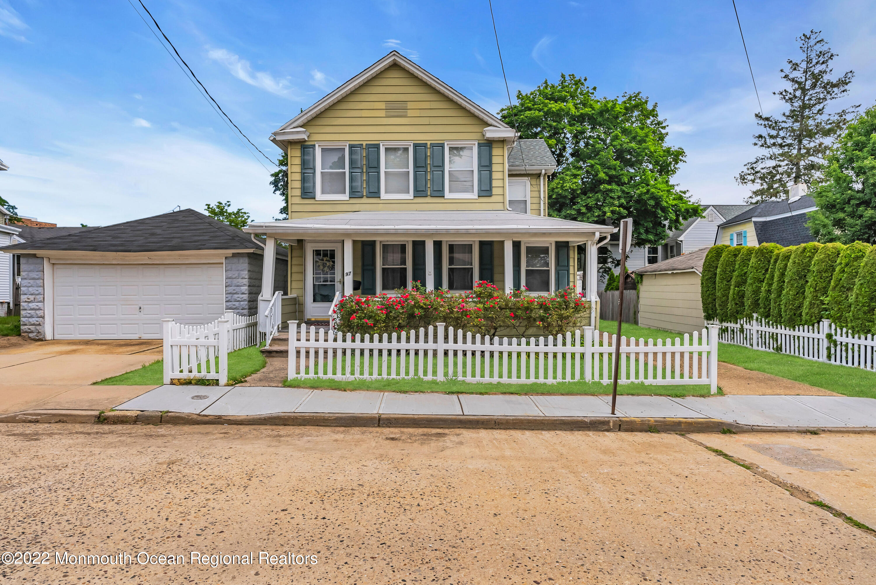 97 Mechanic Street Red Bank, NJ 07701 - Photo 5 of 28 a front view of a house with a yard