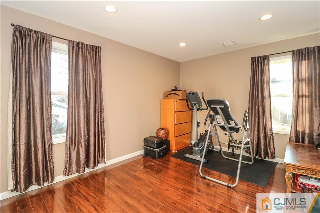 4 Colton Road Edison, NJ 08817 - Photo 22 of 25 a view of a room with gym equipment