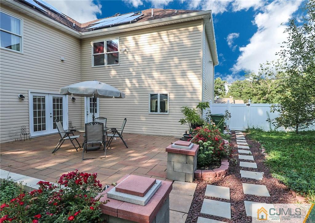 4 Colton Road Edison, NJ 08817 - Photo 23 of 25 a view of a patio with table and chairs and potted plants