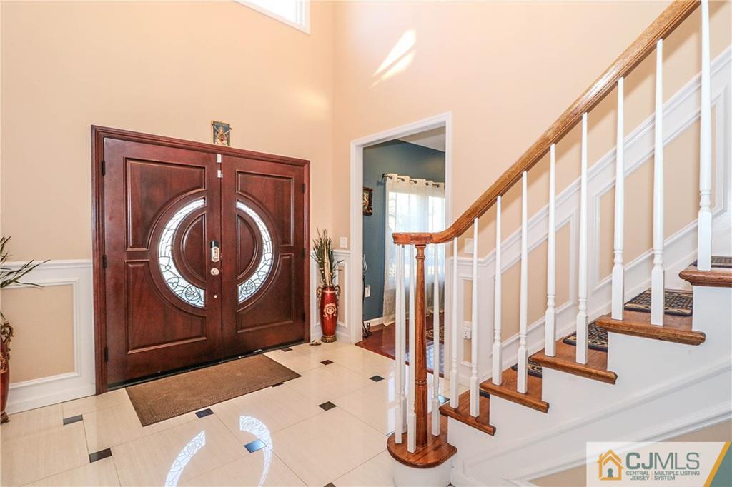 4 Colton Road Edison, NJ 08817 - Photo 4 of 25 a front view of a house with wooden floor and windows