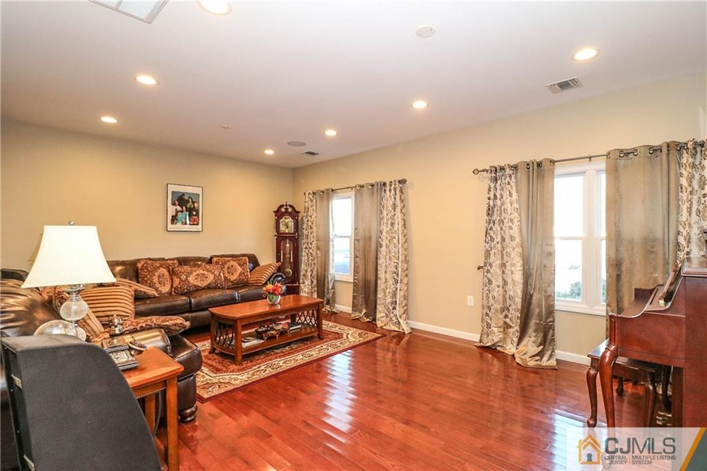 4 Colton Road Edison, NJ 08817 - Photo 9 of 25 a living room with furniture and wooden floor
