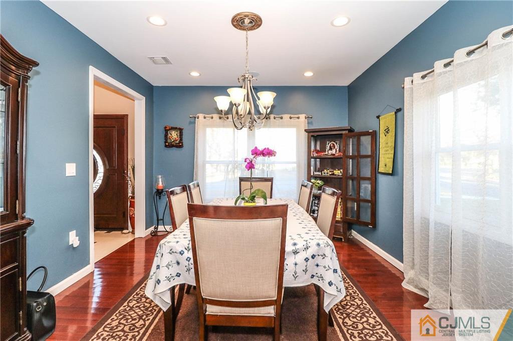 4 Colton Road Edison, NJ 08817 - Photo 10 of 25 a dining room with wooden floor and chandelier