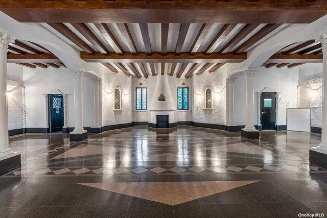 a view of a hall with wooden floor