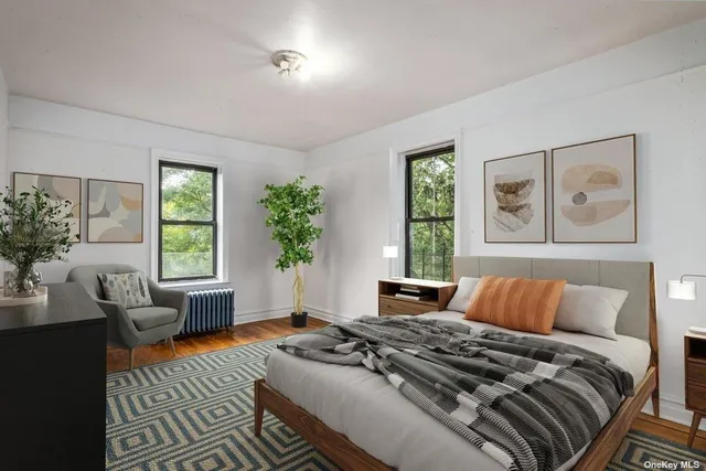 a bedroom with a large bed and a couch