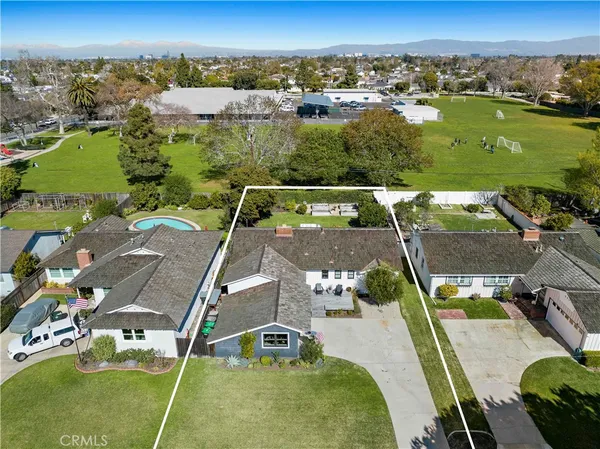 an aerial view of a house with a garden