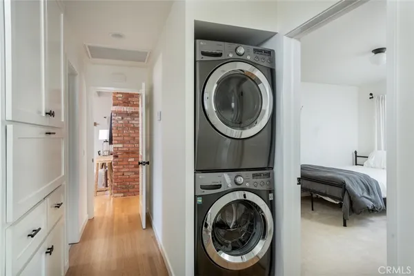 a view of a hallway with washer and dryer