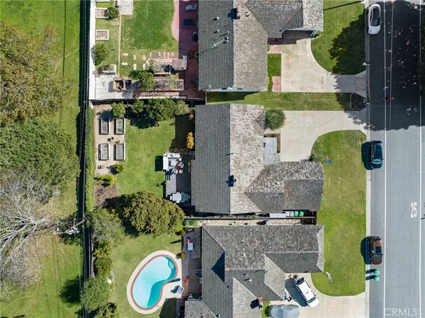 aerial view of a house with a yard