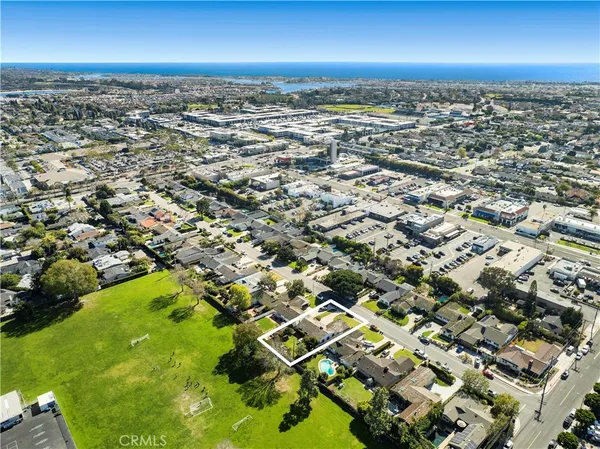 an aerial view of residential building with parking space