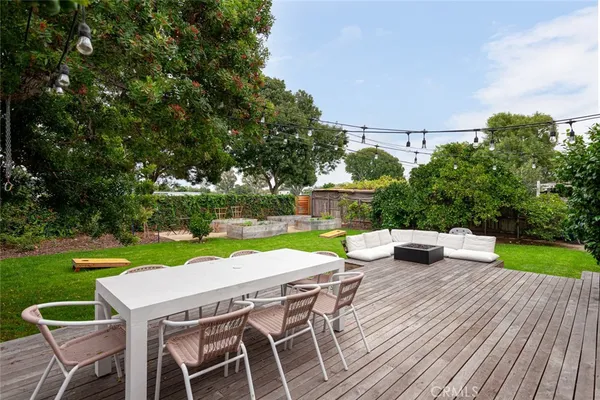 an outdoor space with furniture and garden