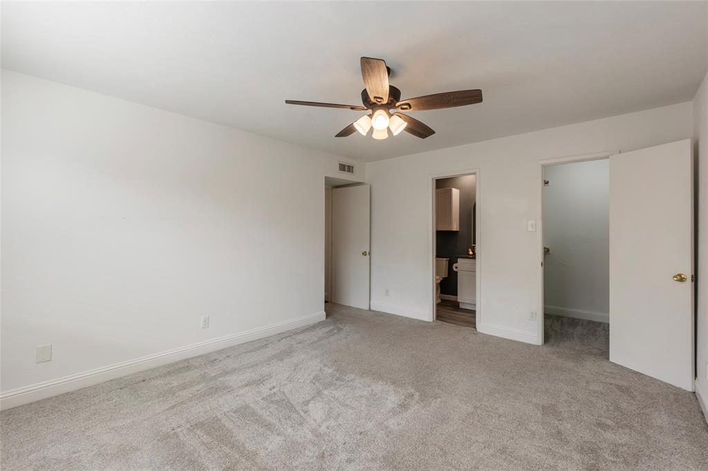 2004 White Ash Road Carrollton, TX 75007 - Photo 26 of 40 Primary bedroom with en suite full bath & walk-in closet