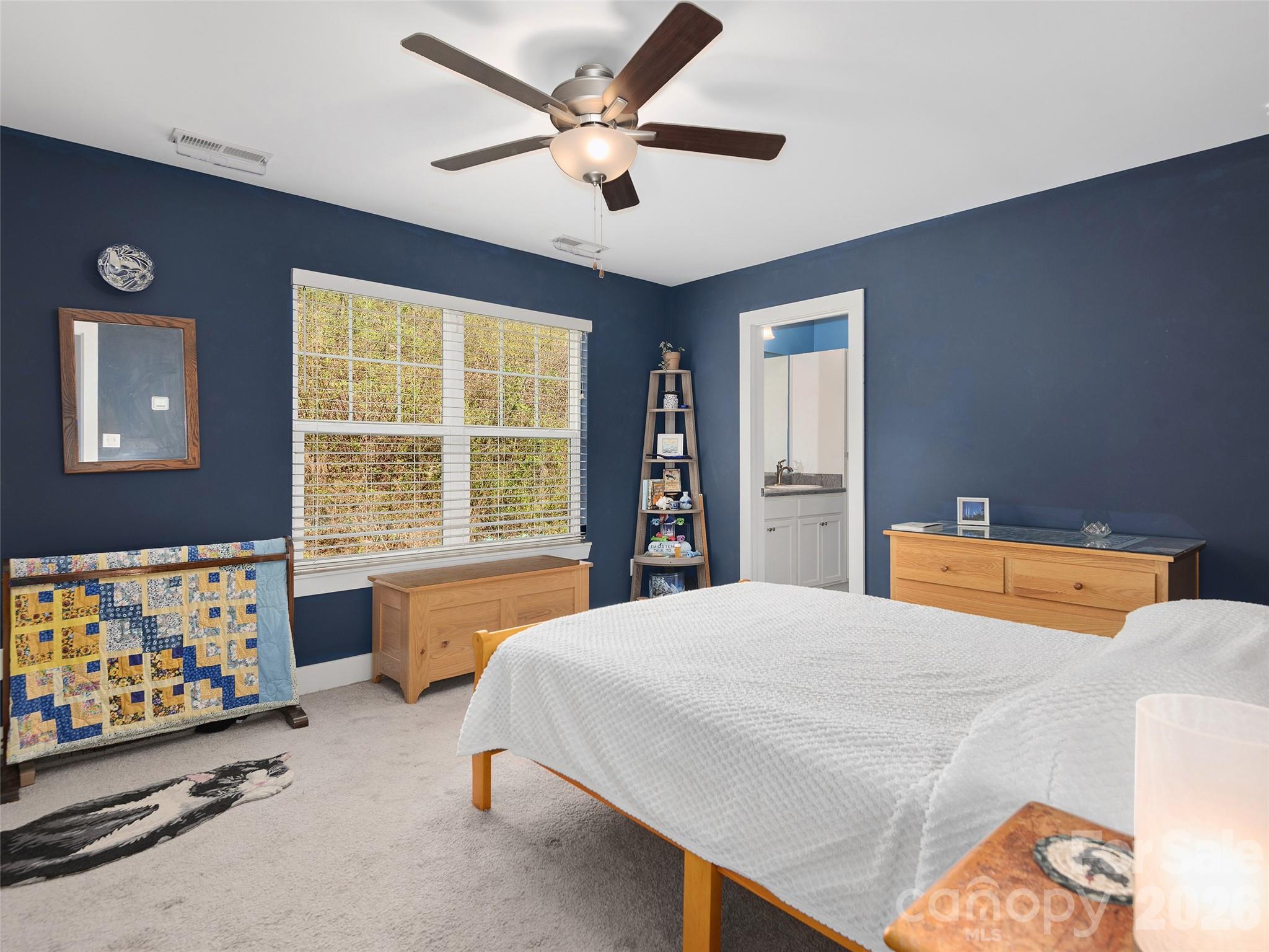 201 Stoney Point Way Candler, NC 28715 - Photo 12 of 18 a bedroom with a bed and a window