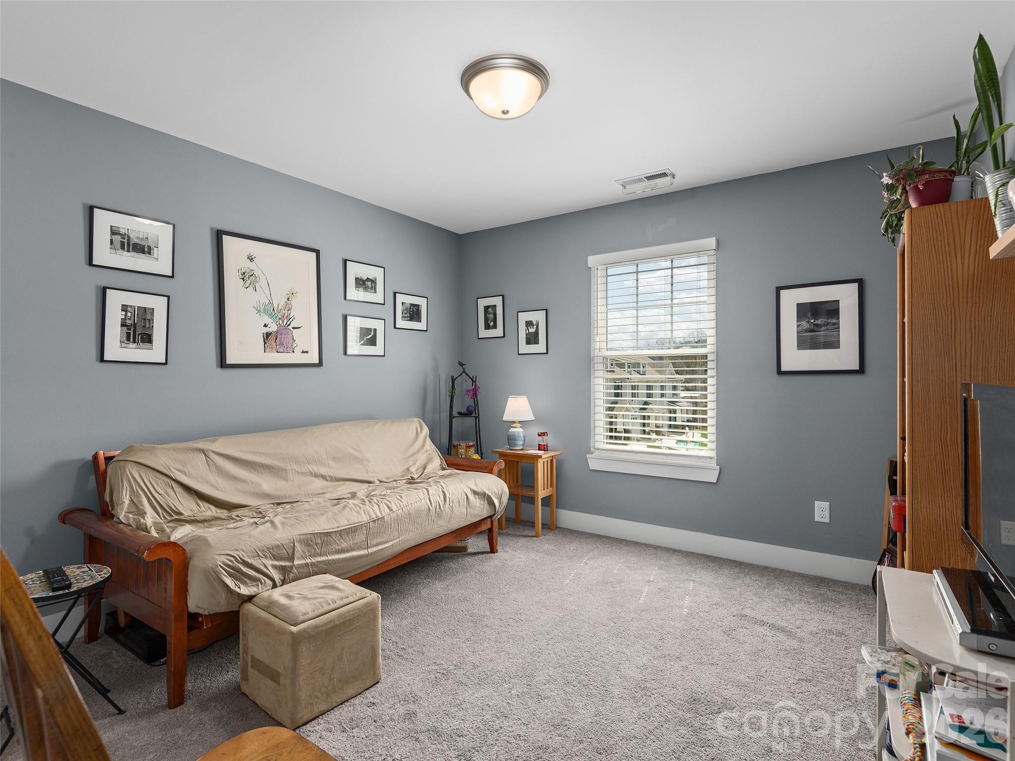 201 Stoney Point Way Candler, NC 28715 - Photo 16 of 18 a bedroom with furniture and a window