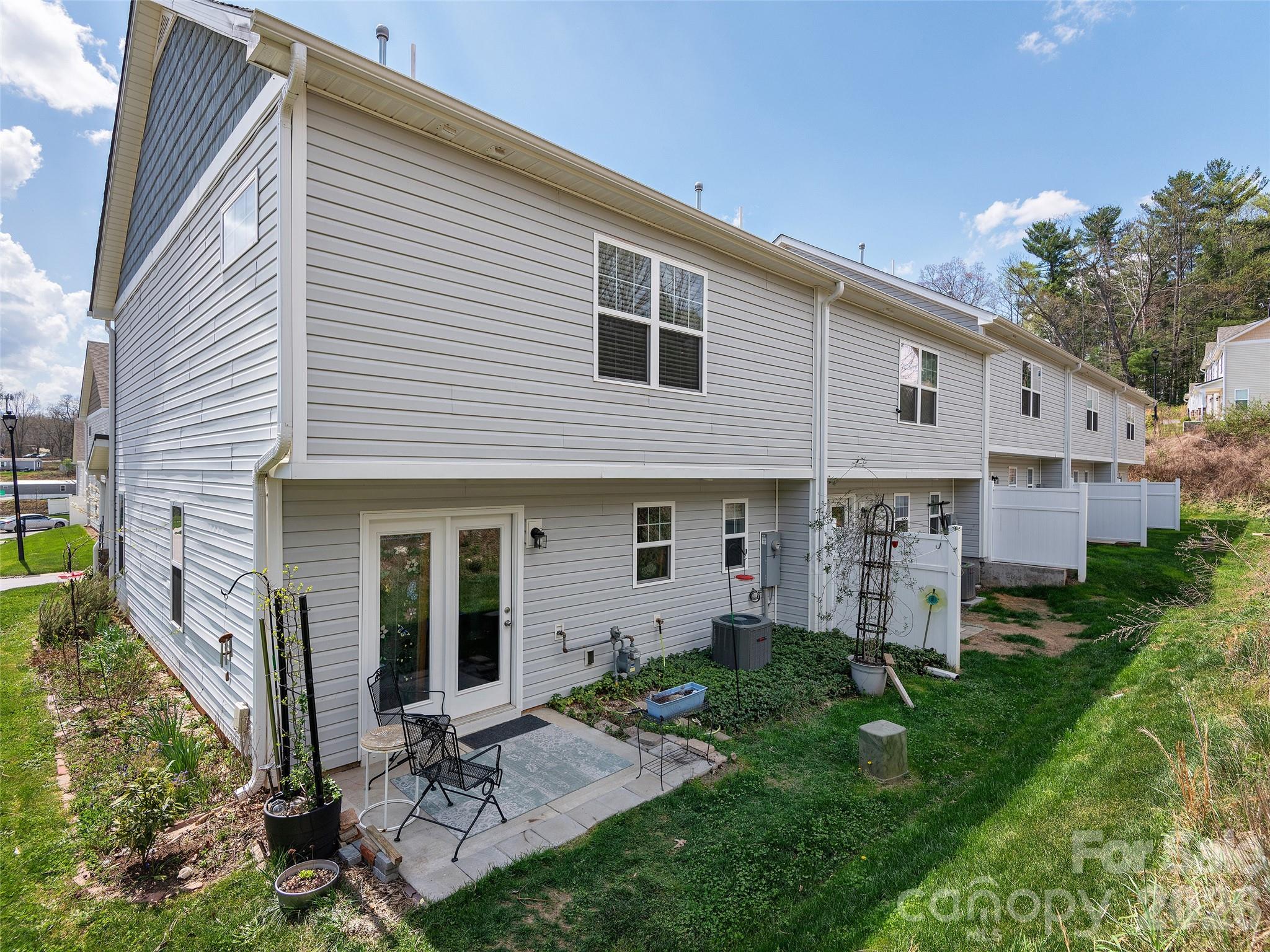 201 Stoney Point Way Candler, NC 28715 - Photo 18 of 18 a view of a house with backyard and porch