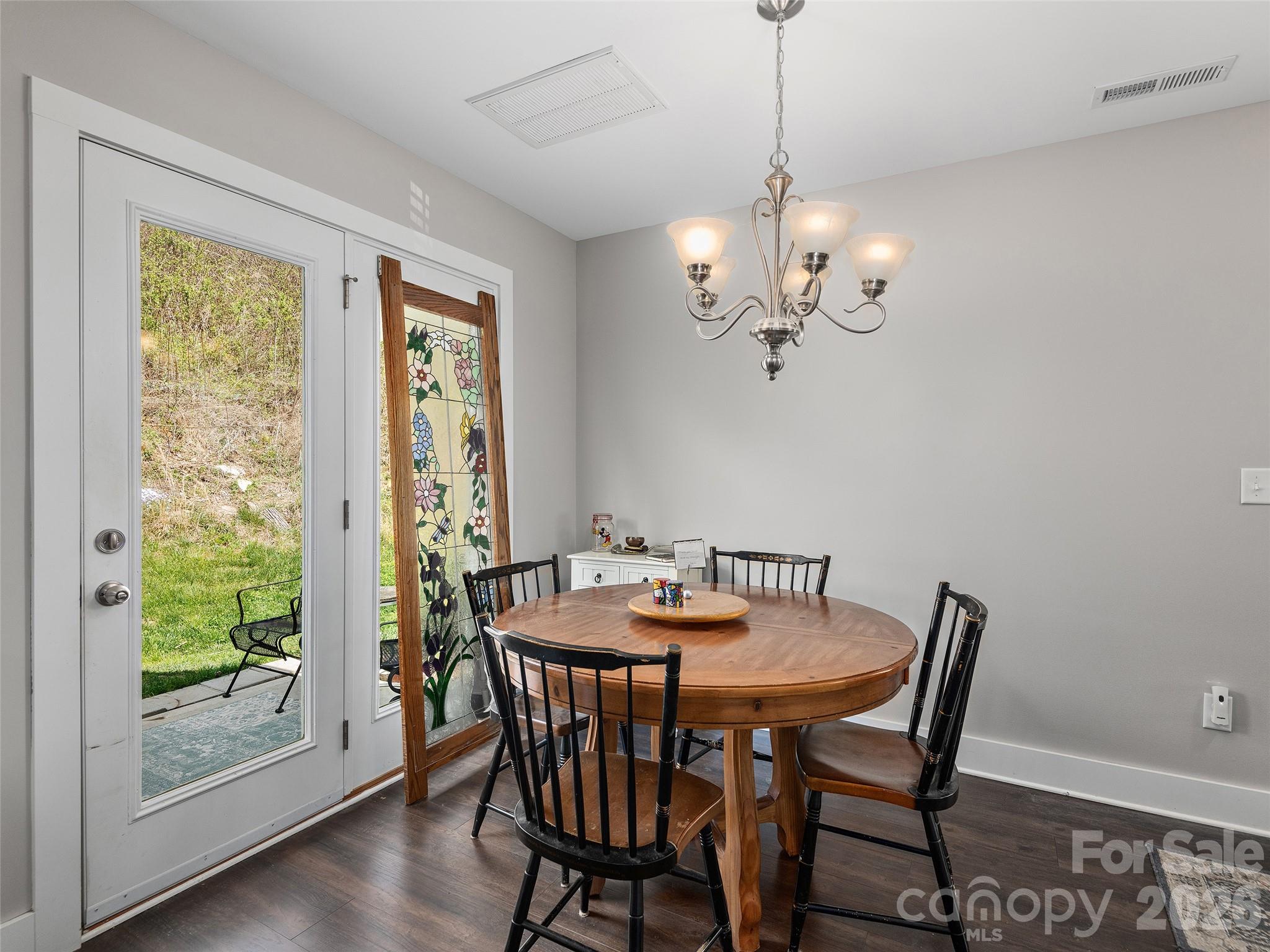 201 Stoney Point Way Candler, NC 28715 - Photo 6 of 18 a view of a dining room with furniture window and wooden floor