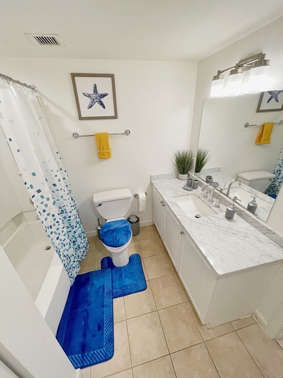10 Museum Way, Unit 321 Cambridge, MA 02141 - Photo 4 of 15 a bathroom with a sink mirror and toilet
