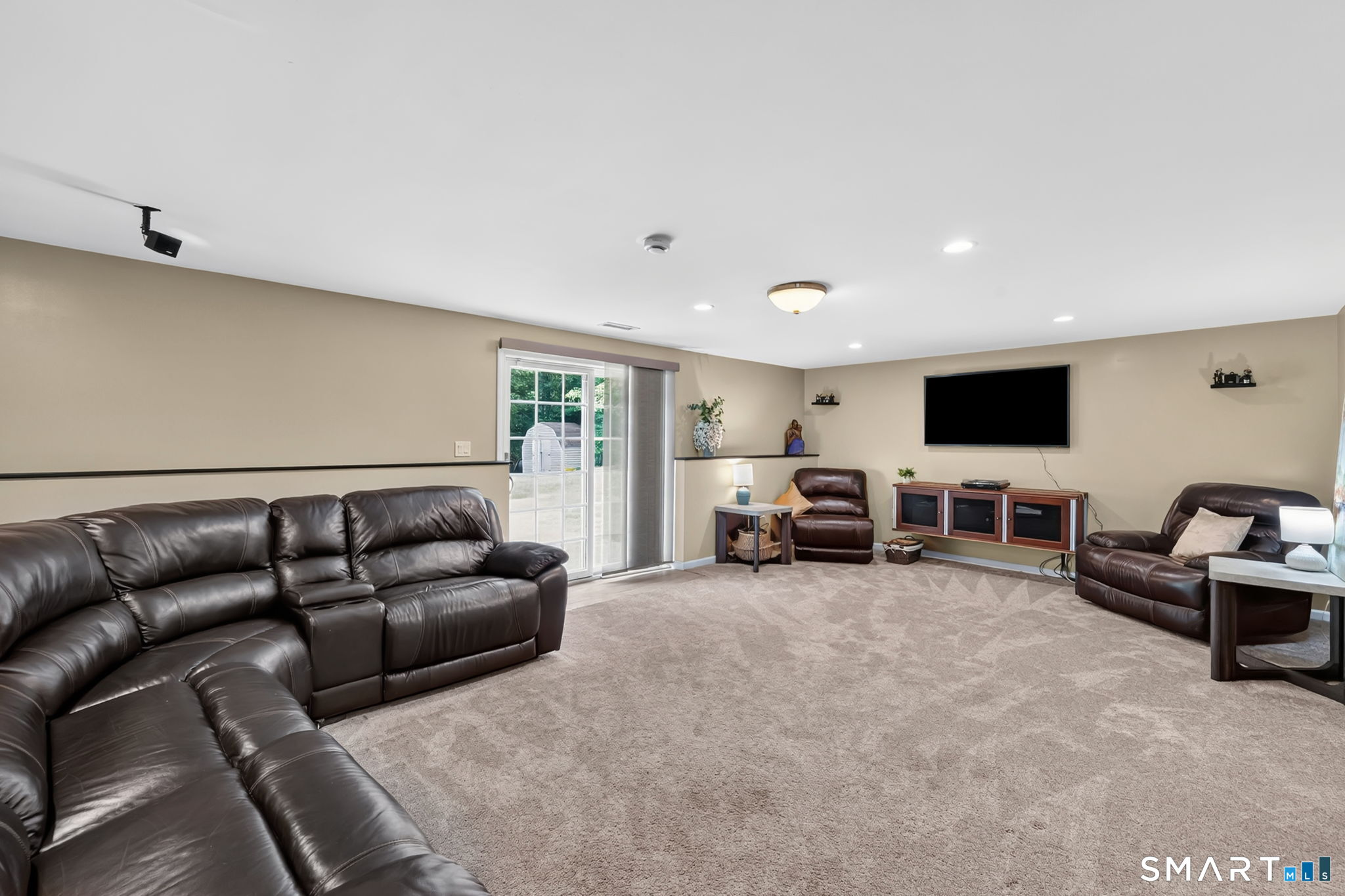 5 Edwards Way Bloomfield, CT 06002 - Photo 34 of 40 Entertainment area of Great Room, with sliding doors to patio and backyard.