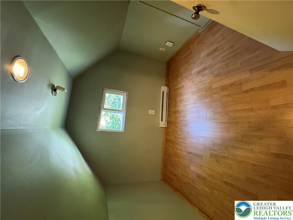 134 Bear Road Kunkletown, PA 18058 - Photo 42 of 42 Angled ceilings and warm wood floors define this cozy upper-level bonus room.