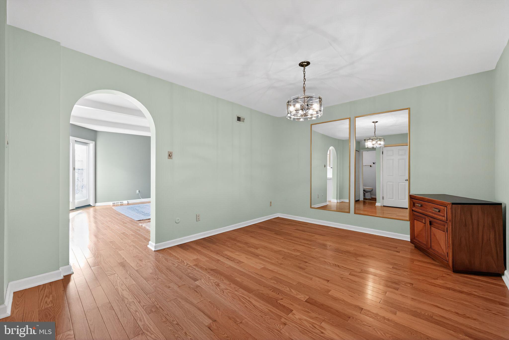 7 Garrison Place Newtown, PA 18940 - Photo 12 of 37 a view of an empty room with wooden floor and a window