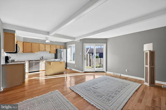 a view of a kitchen counter top space and wooden floor