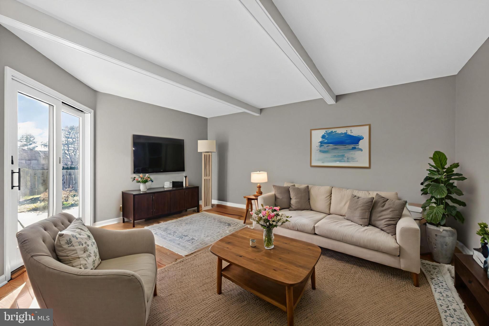 7 Garrison Place Newtown, PA 18940 - Photo 19 of 37 a living room with furniture and a flat screen tv