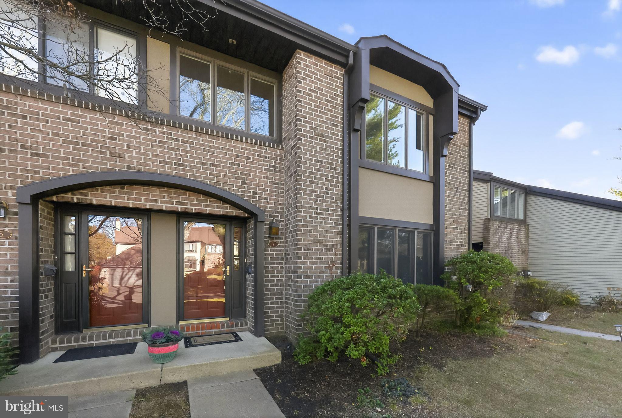 7 Garrison Place Newtown, PA 18940 - Photo 2 of 37 a front view of a house with garden