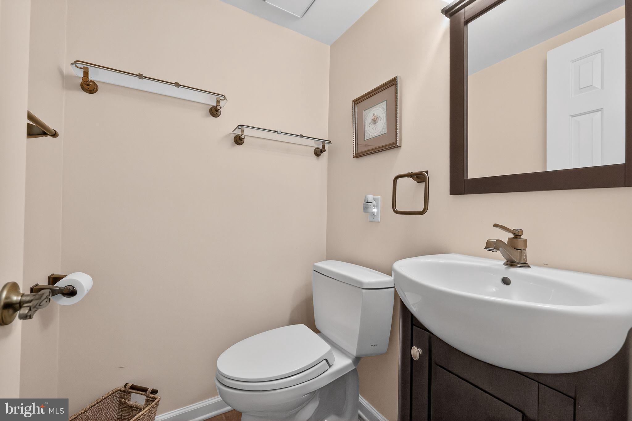 7 Garrison Place Newtown, PA 18940 - Photo 21 of 37 a bathroom with a sink a toilet and a mirror