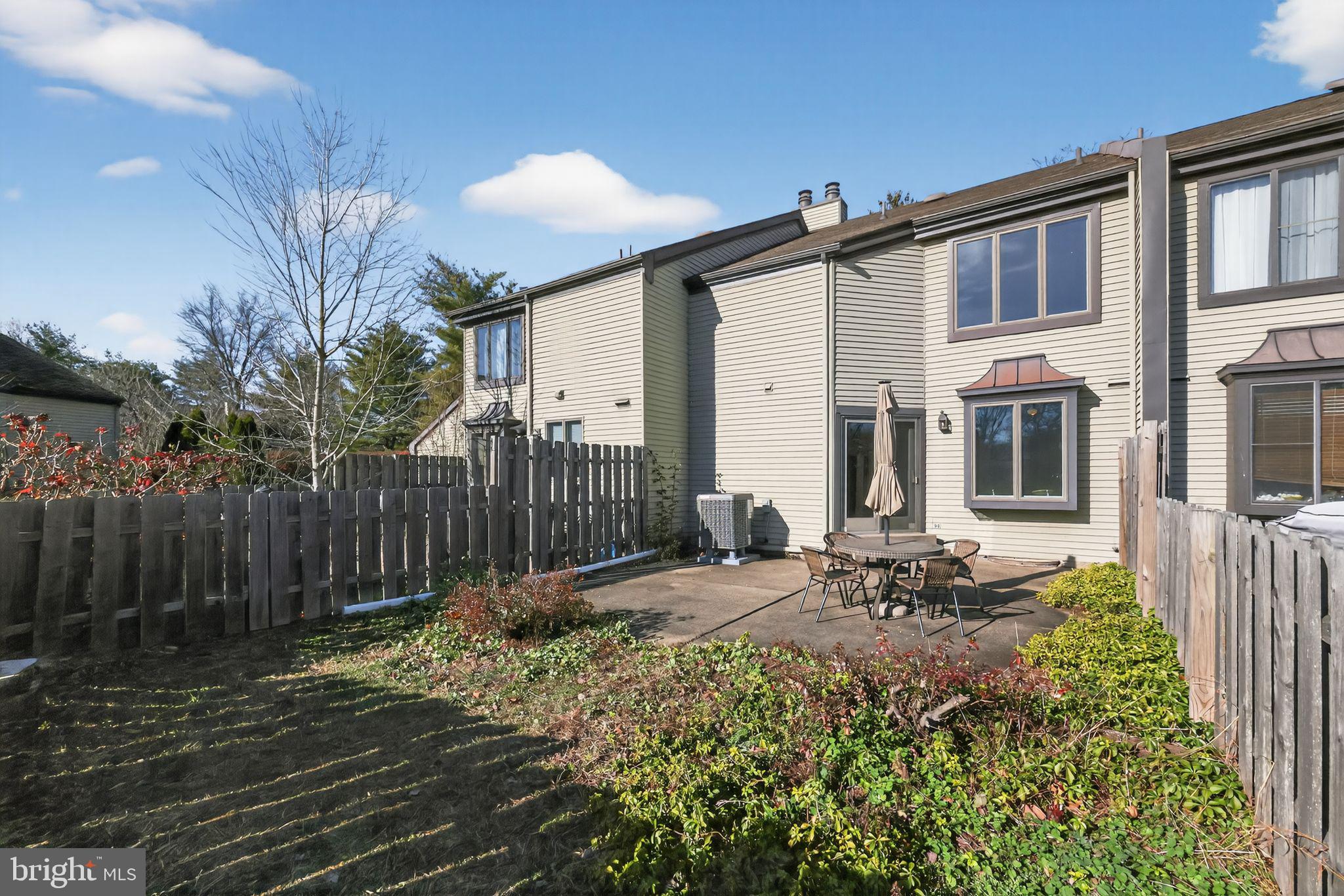 7 Garrison Place Newtown, PA 18940 - Photo 36 of 37 a backyard of a house with table and chairs