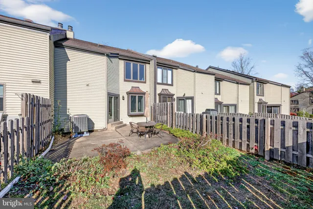 a view of a porch with furniture and backyard