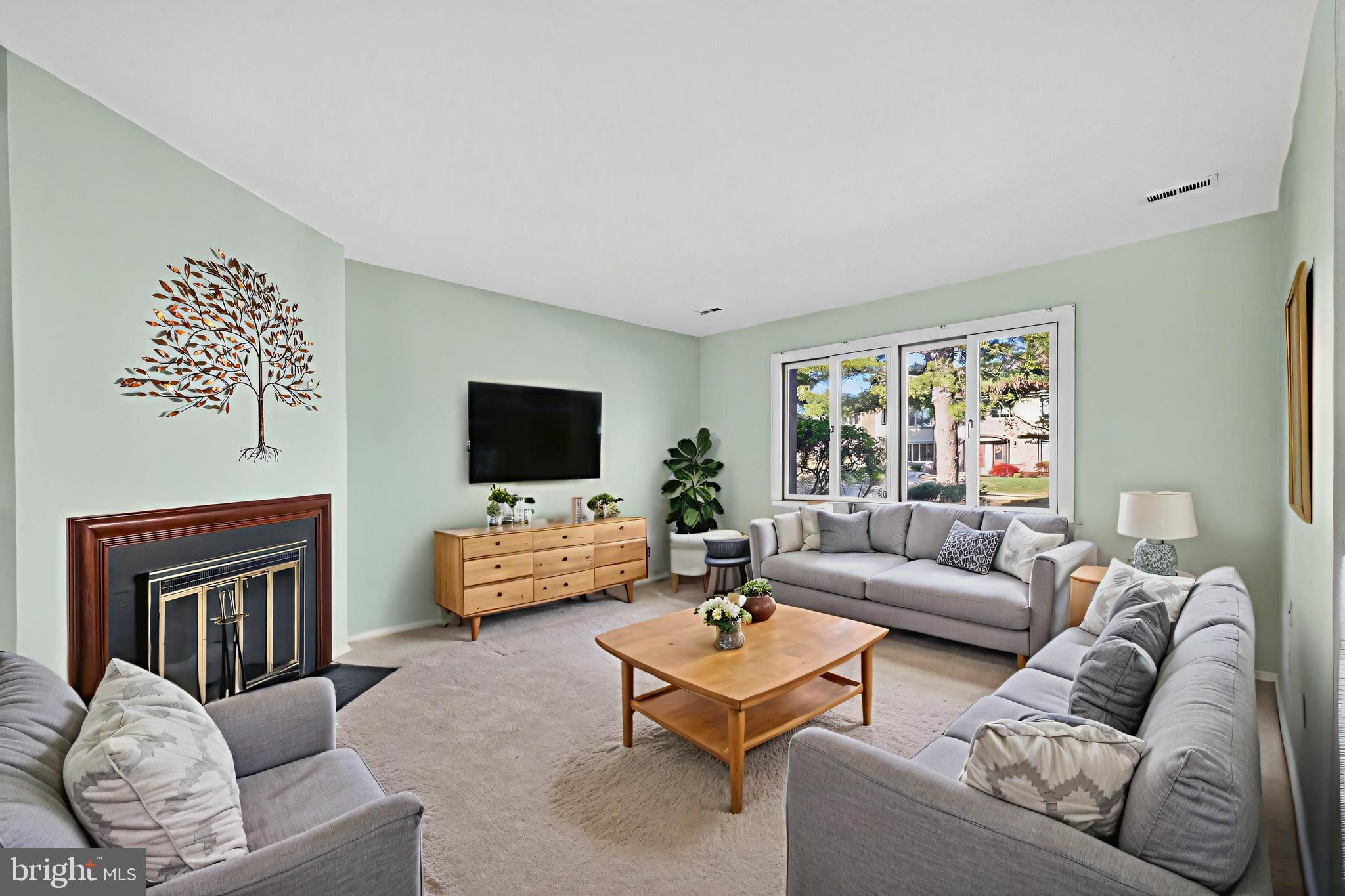 7 Garrison Place Newtown, PA 18940 - Photo 7 of 37 a living room with furniture and a flat screen tv
