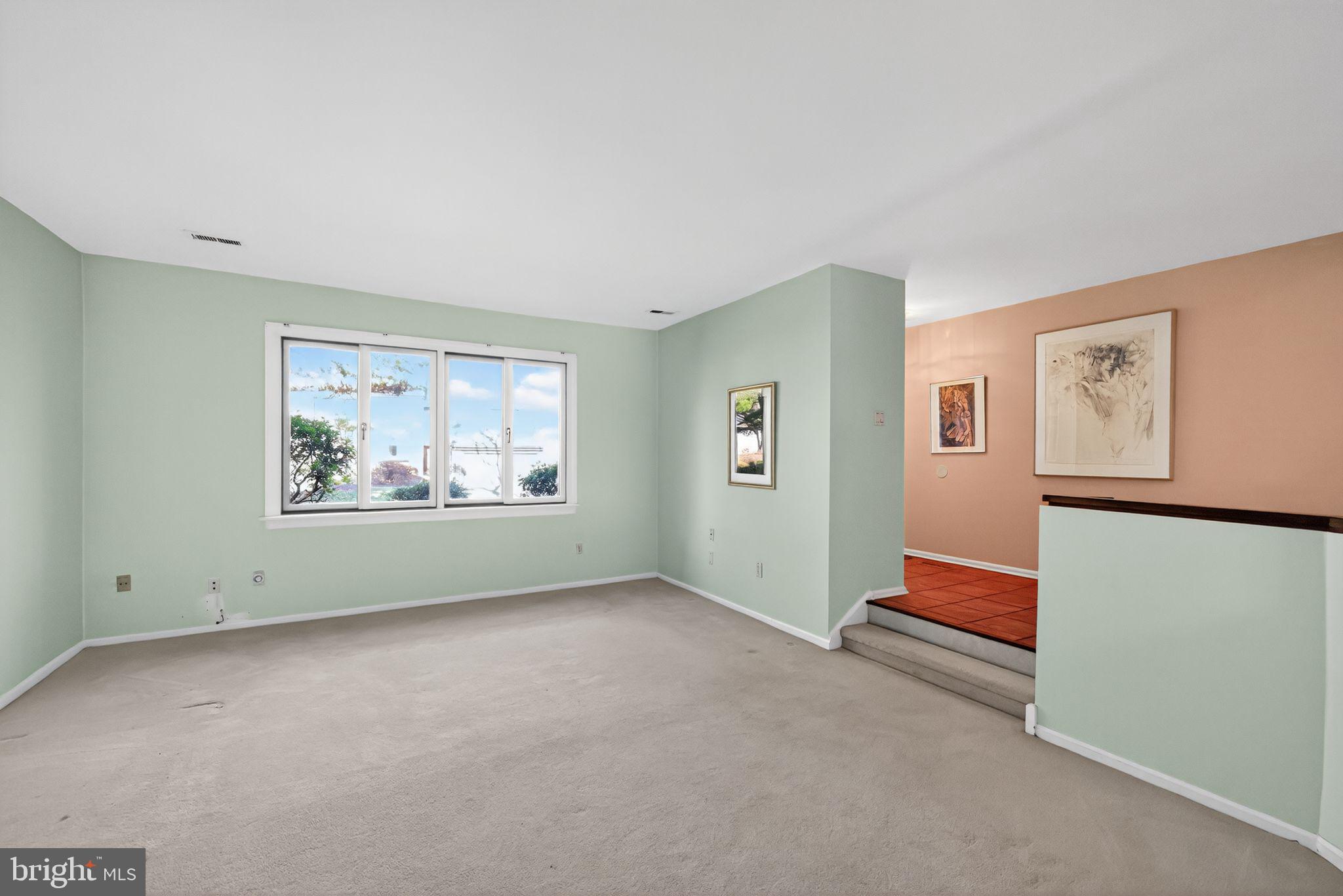 7 Garrison Place Newtown, PA 18940 - Photo 9 of 37 an empty room with painting on the wall and a window