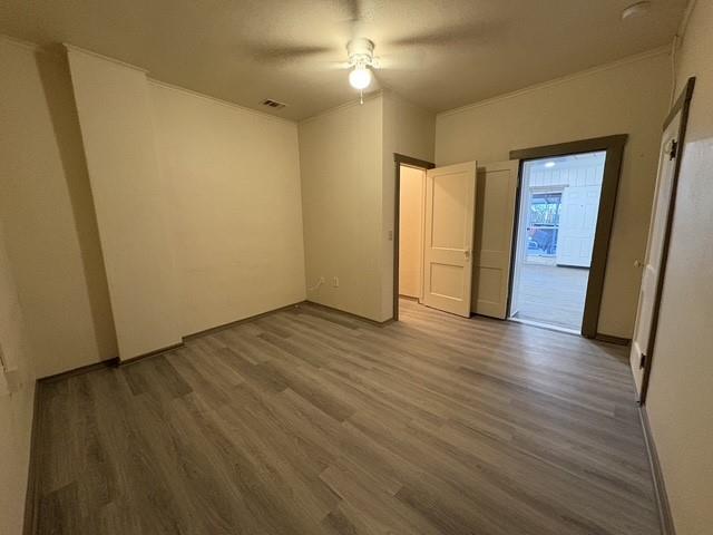 4876 East Williams Spring Road Fort Worth, TX 76135 - Photo 12 of 20 an empty room with wooden floor and windows
