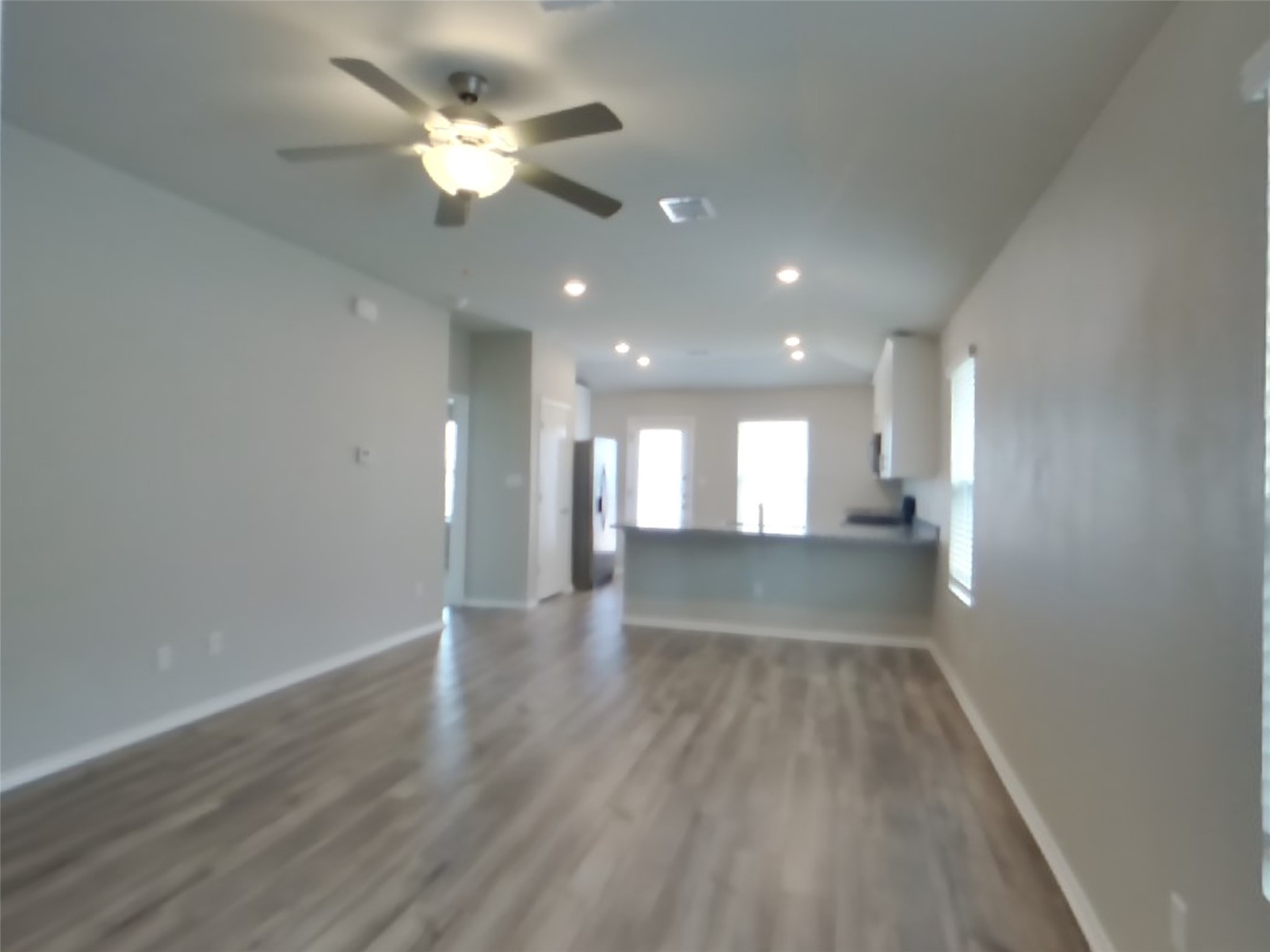 3509 Gooseneck Lane Georgetown, TX 78626 - Photo 3 of 26 a view of empty room with wooden floor and fan