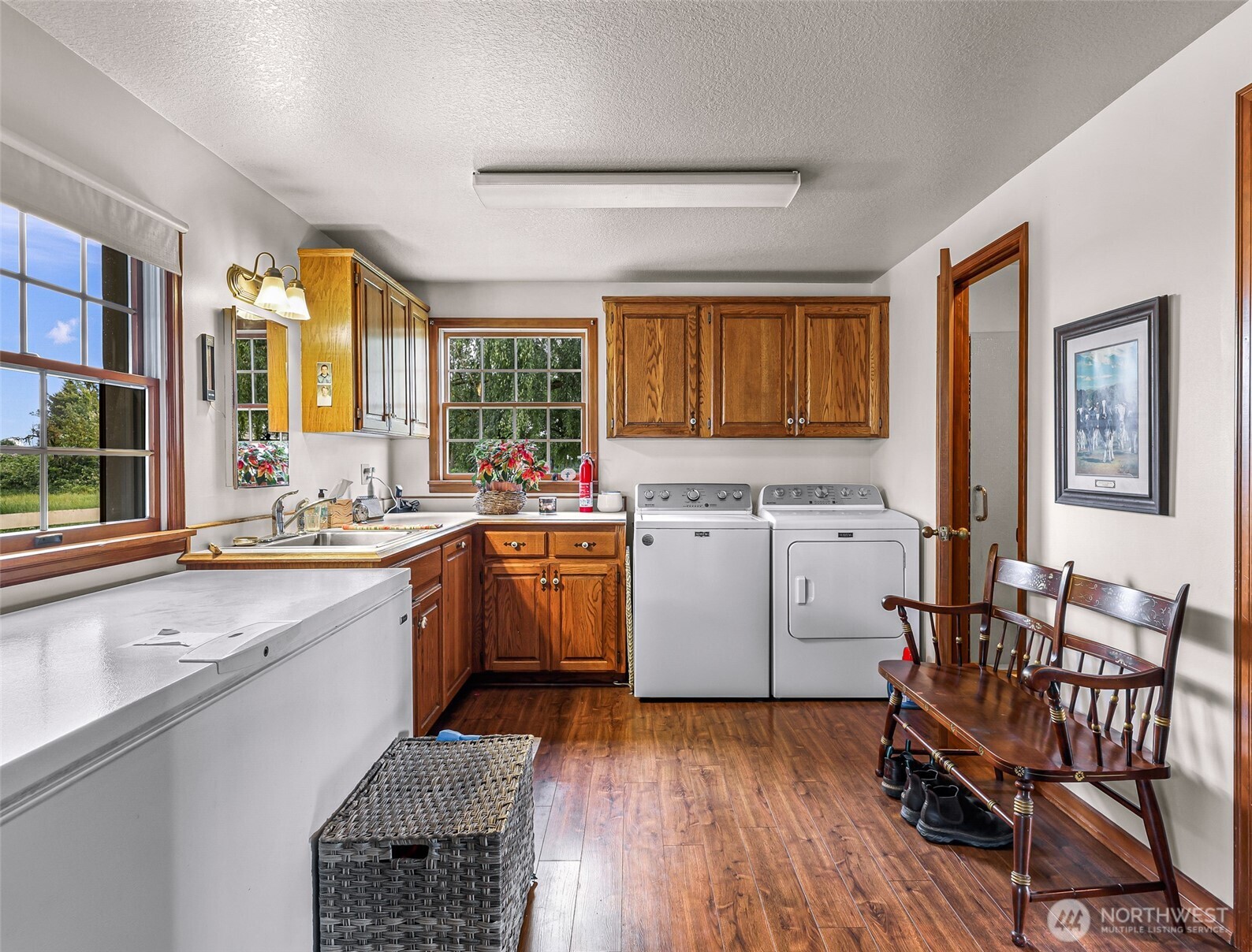 8634 Double Ditch Road Lynden, WA 98264 - Photo 15 of 40 a kitchen with sink cabinets and wooden floor