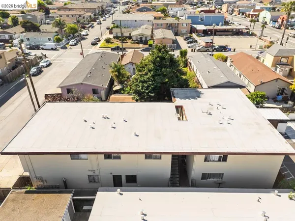 an aerial view of residential houses with outdoor space