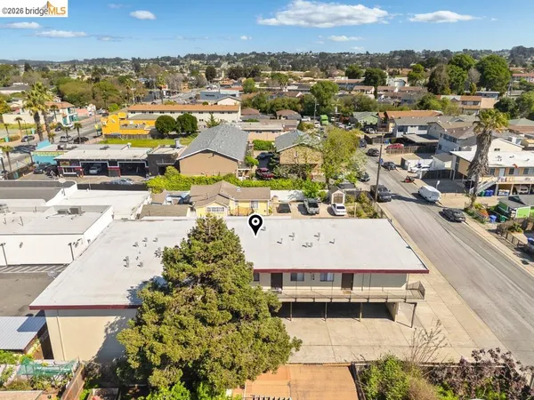 an aerial view of residential houses with outdoor space