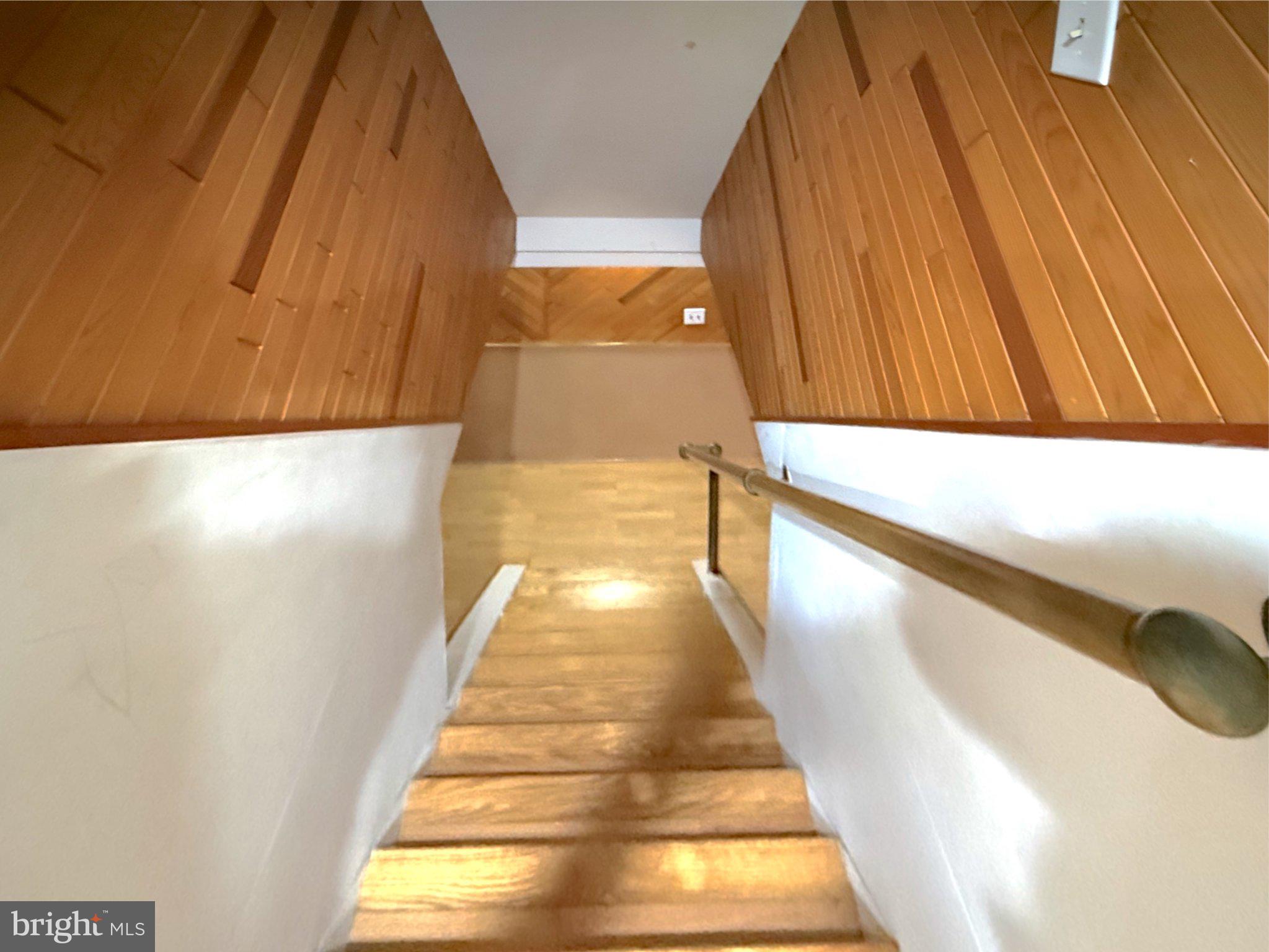 9006 Sidehill Road Ellicott City, MD 21042 - Photo 38 of 53 Inviting descent into warmth and wood.