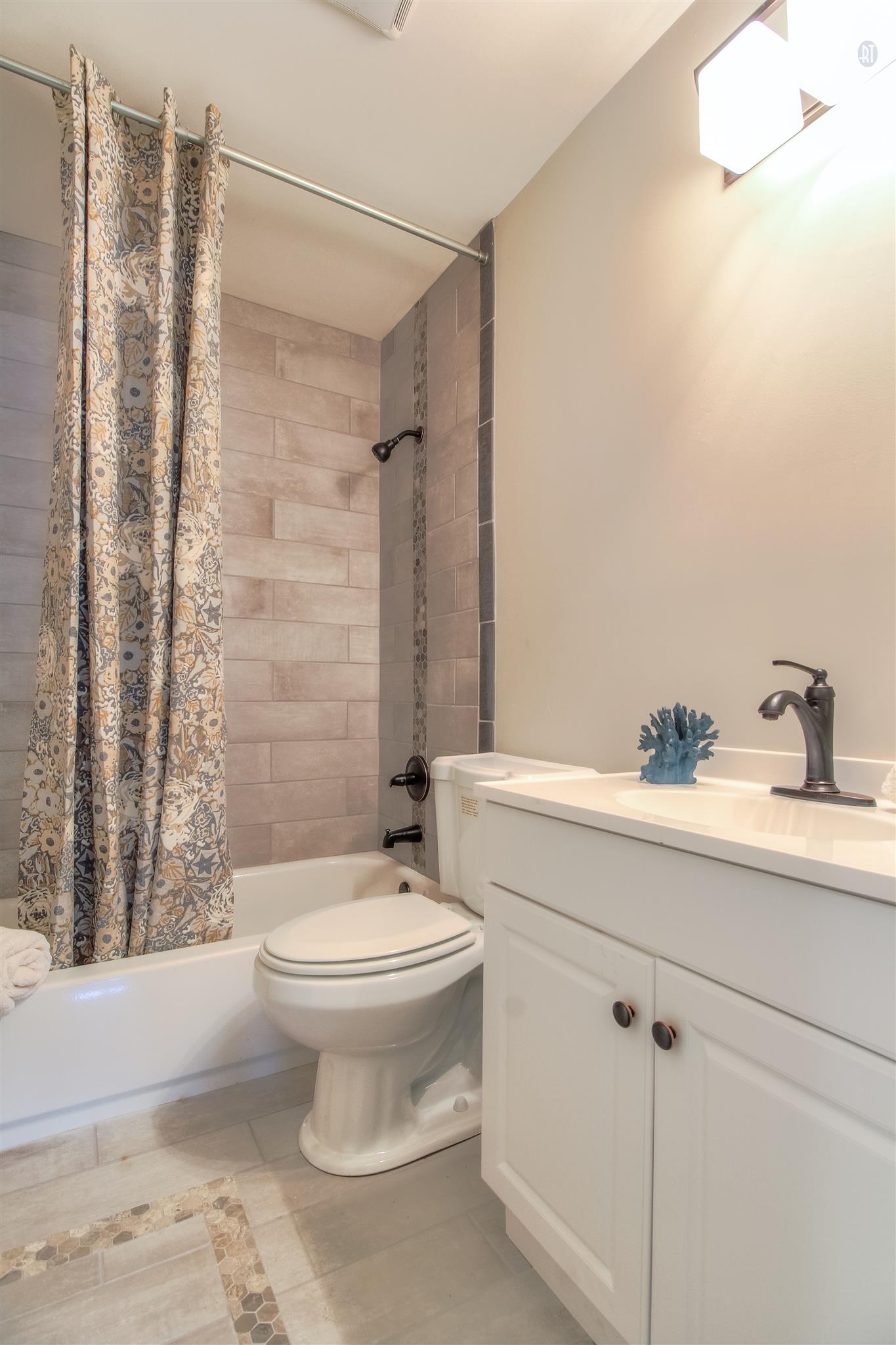 304 Warrior Road Madison, TN 37115 - Photo 12 of 16 The full bath features a custom tiled combination tub/shower.
